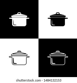 Set Cooking pot icon isolated on black and white background. Boil or stew food symbol.  Vector Illustration