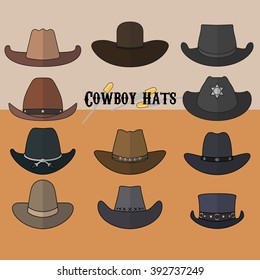 Set of cowboy hats on sand background 