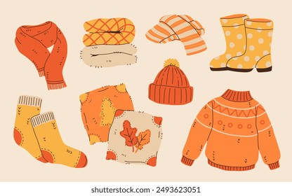 Set of cozy autumnal sweaters, scarves, socks, and warm accessories. Fall apparel clothes, cardigan, beanie kit. Vector hand drawn flat cartoon collection illustration