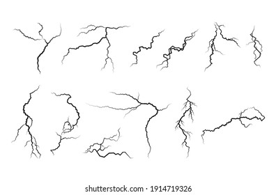 Set of cracks. Collection of different black lightning bolts. Earth crack. Set thunderstorm and lightning.Vector illustration of natural phenomena on white background.