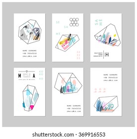 Set of creative cards with geometric outline shapes and crystals. Trendy hipster logotypes. Polygonal icons with artistic colored background. Vector. Isolated.
