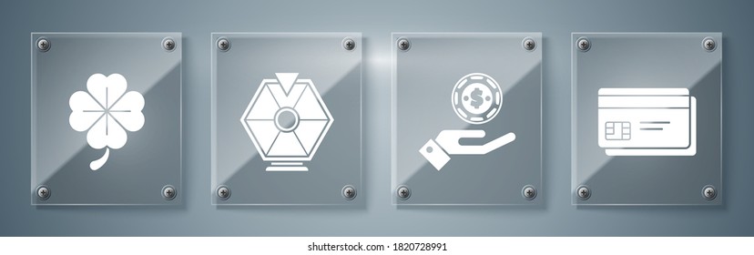 Set Credit card, Hand holding casino chips, Lucky wheel and Four leaf clover. Square glass panels. Vector