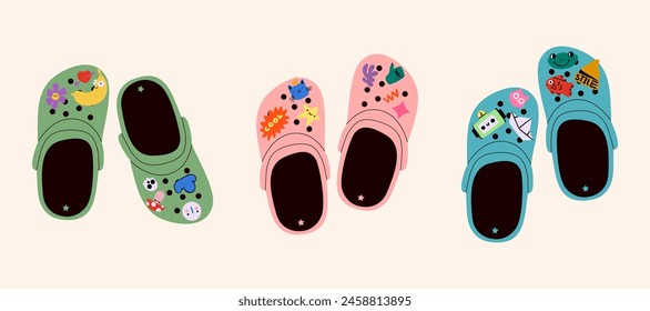 Set of crocs with embellishments. Unisex slates. Trendy vector illustration.
