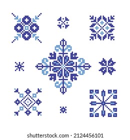 Set of cross stitched snowflake patterns