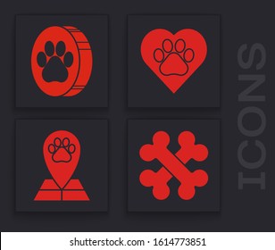 Set Crossed bones, Paw print, Heart with animals footprint and Map pointer with veterinary medicine hospital icon. Vector
