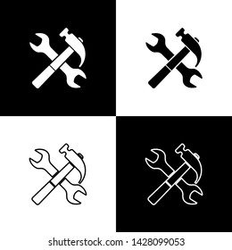 Set Crossed hammer and wrench icon isolated on black and white background. Hardware tools.  Vector Illustration