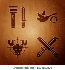 Set Crossed hunter knife, Flashlight and knife, Hunt on moose with crosshairs and Hunt on duck with crosshairs on wooden background. Vector