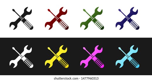 Set Crossed screwdriver and wrench tools icon isolated on black and white background. Service tool symbol.  Vector Illustration