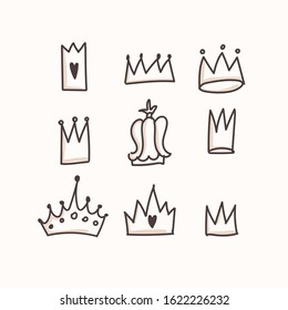 Set of crown icons on an isolated background. The crowns are drawn in a hand-drawn style. Icons can be used in creating calendars, notebooks, and stickers. Doodle. Vector on a white background. EPS10.
