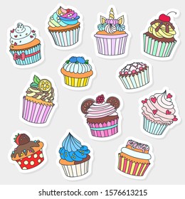 Set of cupcake stickers. Doodle illustration of cupcakes decorated with cream, raspberry, hearts, cherry, citrus, blueberry and cookies. Vector 8 EPS.