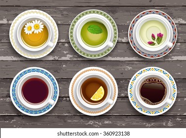 Set of cups of coffee and tea. Wooden background