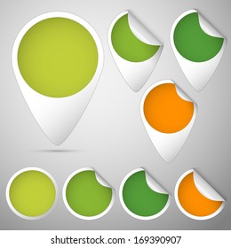 set of curled tags and circles colored green and orange for spring