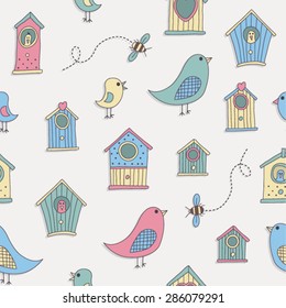 A set of cute bird houses and birds in a repeat pattern