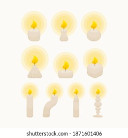 Set of cute burning candles of different shapes. Isolated objects in the white background. Flat style illustration.