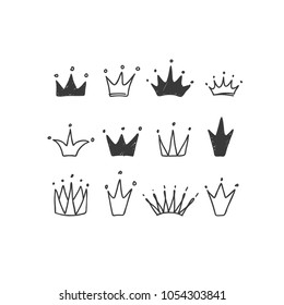 Set of cute cartoon crowns. Hand drawing vector background. Graphic black on white background. Vector illustration.