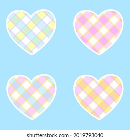 Set of cute colored hearts in a box. Design elements isolated on blue background.