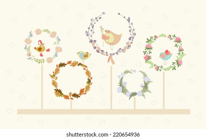 set of cute floral wreaths and birds in them