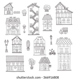Set of cute hand drawn houses, street lights and trees . Vector city street collection