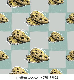 Set of cute hand drawn soft colored biscuit. Vector illustration. Set of isolated home breakfast party elements. Sketch pattern on blue checkered tablecloth background