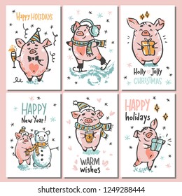 Set of cute hand drawn vectorcards with pigs, doing winter activity, ice skating, drinking hot chocolate, decorating christmas tree, giving presents, reading, making snowman, and hand lettered signs