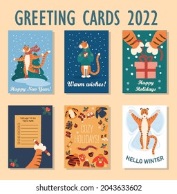 set of cute holiday cards for new year tiger 2022: tiger on skates, with hot cup in its paws, tiger paws open gift box, to-do list, tiger in the snow. Vector New Year illustration