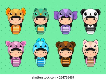 Set of cute Japanese Kokeshi Dolls in animal costumes. 