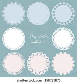 Set of cute lacy doilies on floral background.