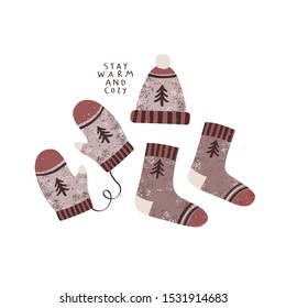 set of cute winter socks, hat and mittens illustrations with "stay warm and cozy" text. Vector illustration of festive winter mittens, socks and hat. Winter holidays card or poster template