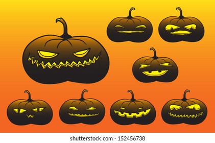 Set of dark Halloween pumpkins glowing in the night.