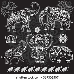 Set of decorated elephants on black