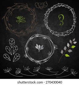 Set decoration. Consists of leaves, twigs, buds, wreaths. Background chalkboard.
