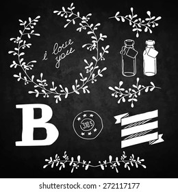 Set decoration. Consists of leaves, twigs, buds, wreaths. Black background.