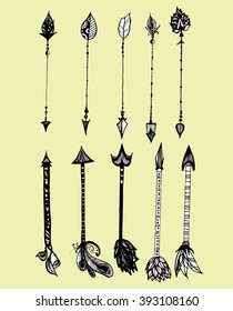 Set of decorative arrows. Stylized arrows. Black and white drawing by hand. Line art. The arrows with feathers. Weapons.