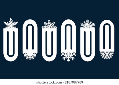A set of decorative bookmarks with cut-out snowflake ornaments. Laser cutting. Paper cut