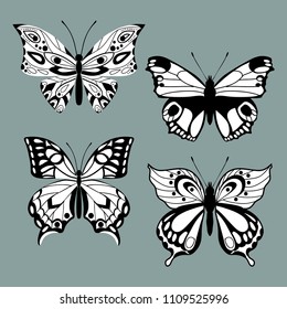 Set decorative butterflies. Set of filigree isolated silhouettes of butterflies . Decorative design elements. Vector illustration.