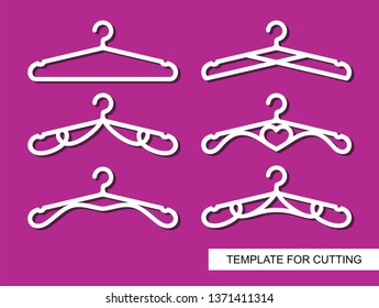 Set of decorative clothes hangers for atelier, wedding salon, boutique or store. White objects on pink background. Template for laser cutting, wood carving, paper cut and printing. Vector illustration