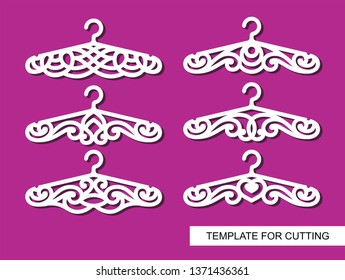 Set of decorative clothes hangers for atelier, wedding salon, boutique or store. White objects on pink background. Template for laser cutting, wood carving, paper cut and printing. Vector illustration