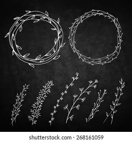 Set of decorative doodle wreaths made of branches. Two wreaths from plants and six different branches. Background chalkboard