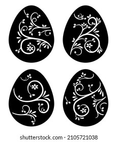 A set of decorative Easter eggs with a cut out pattern. Stencil, template for cutting. Black silhouette of eggs with floral ornament. Vector illustration isolated on white background. Home decoration