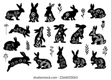 Set of decorative Easter rabbits in folk style. Floral separate individual design elements. Black and white vector illustration