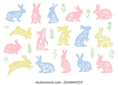 Set of decorative Easter rabbits in folk style. Colored floral separate individual design elements. Vector illustration