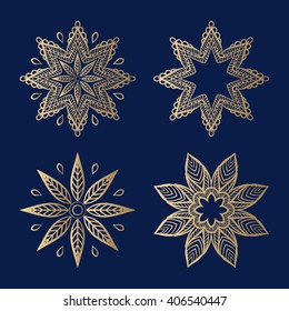 Set of decorative elements in the form of stylized flowers with a golden hue. Stars, asters, flowers 8 rays. Harmony, luck, protection symbol.