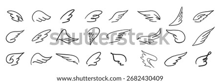 set of decorative ornaments of wings hand drawn in doodle style