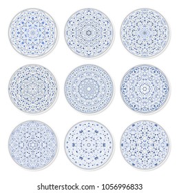 Set of decorative plates with a circular arabic blue pattern, top view. White background. Vector illustration.