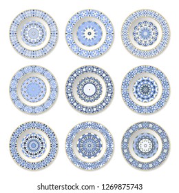 Set of decorative plates with a circular blue pattern, top view. White background. Vector illustration.