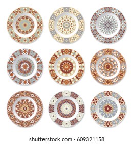 Set of decorative plates with a circular orange pattern, top view. White background. Vector illustration.