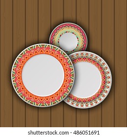 Set of decorative plates with a ethnic tribal ornament of handwork and an empty space in the center. Vector illustration.