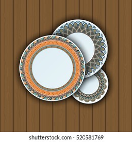Set of decorative plates with a ethnic tribal ornament of handwork and an empty space in the center. Vector illustration.