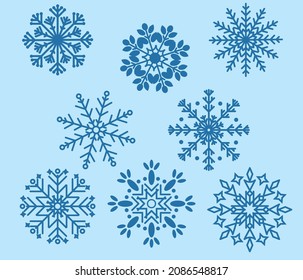 Set of delicate snowflakes on a blue background. Winter selection of snowflakes to decorate your projects. Vector graphics.