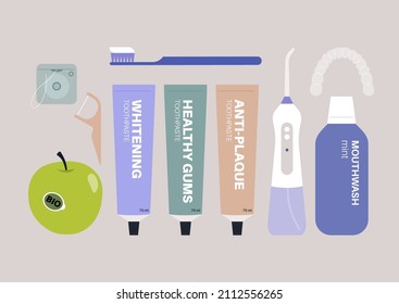 A set of dental hygiene products, a tube of toothpaste, a toothbrush, a dental floss, a flosser, an irrigator, a mouthwash, a whitening tray, and a green apple